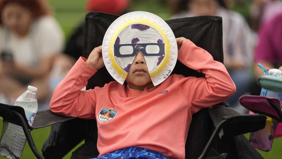 Yurem Rodriquez watches as the moon partially covers the sun during a total solar eclipse, as seen from Eagle Pass, Texas, Monday, April 8, 2024. Yurem Rodriquez watches as the moon partially covers the sun during a total solar eclipse, as seen from Eagle Pass, Texas, Monday, April 8, 2024.