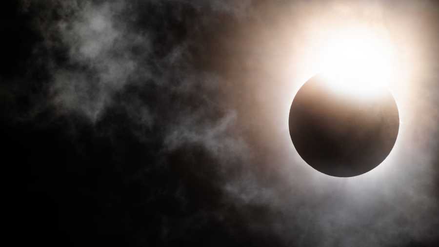 The moon begins its descent below the sun's horizon during a total solar eclipse on April 08, 2024 in Brady, Texas. The moon begins its descent below the sun's horizon during a total solar eclipse on April 08, 2024 in Brady, Texas.