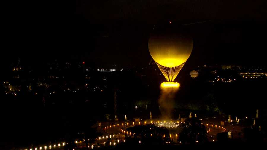 Opening Ceremony - Olympic Games Paris 2024: Day 0 PARIS, FRANCE - JULY 26: (EDITOR'S NOTE: This Handout screengrab was provided by a third-party organization and may not adhere to Getty Images' editorial policy.) This handout released by the Olympic Broadcasting Services, shows an aerial view of the cauldron, with the Olympic flame lit, lifting off while attached to a balloon during during the opening ceremony of the Paris 2024 Olympic Games Paris 2024 on July 26, 2024 in Paris, France. (Screengrab by IOC via Getty Images)