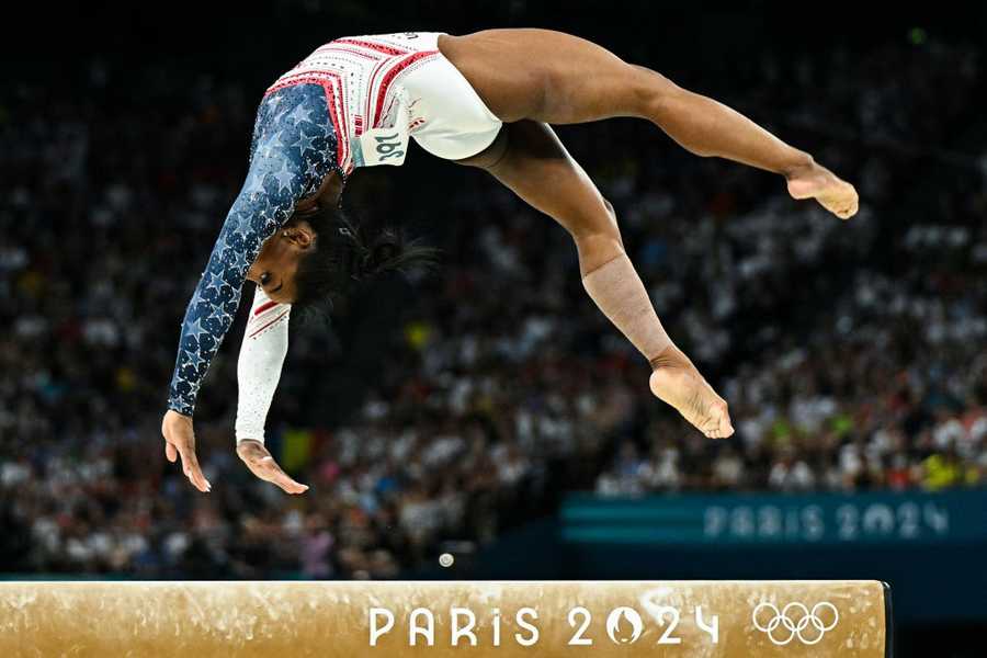 TOPSHOT-GYMNASTICS-ARTISTIC-OLY-PARIS-2024 TOPSHOT - US' Simone Biles competes in the balance beam event of the artistic gymnastics women's team final during the Paris 2024 Olympic Games at the Bercy Arena in Paris, on July 30, 2024. (Photo by Gabriel BOUYS / AFP) (Photo by GABRIEL BOUYS/AFP via Getty Images)