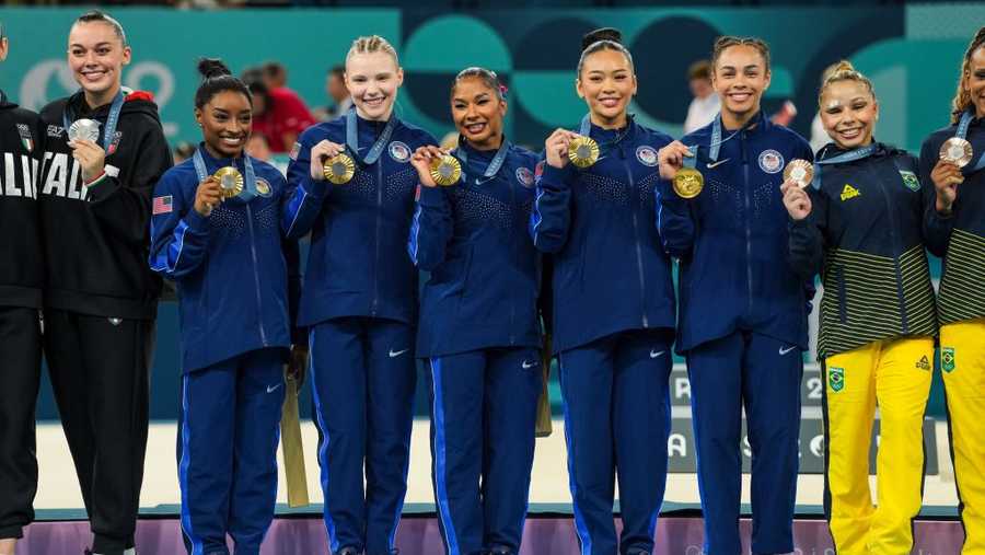 Artistic Gymnastics - Paris 24 Olympics Games - Day 4 PARIS, FRANCE - JULY 30: Simone Biles of United States, Jade Carey of United States, Jordan Chiles of United States, Sunisa Lee of United States and Healy Rivera of United States celebrate on the podium for winning the gold medal during Women's Team Final of the Artistic Gymnastics on Bercy Arena during the Paris 2024 Olympics Games on July 30, 2024 in Paris, France. (Photo By Alvaro Diaz/Europa Press via Getty Images)